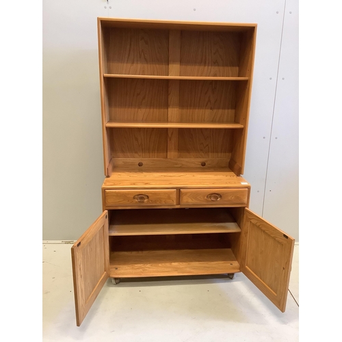 1009 - An Ercol Windsor elm side cabinet, width 91cm, depth 43cm, height 160cm. Condition - good