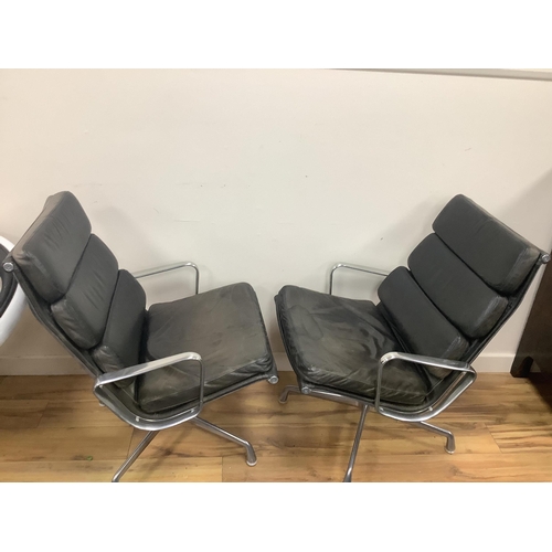 1054 - Charles and Ray Eames for Herman Miller, a pair of EA216 black leather and aluminium high back swive... 