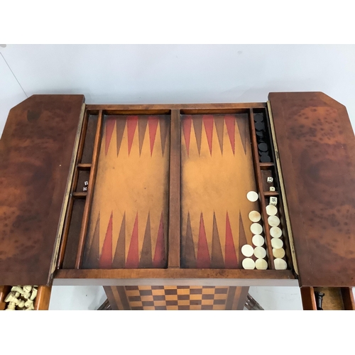 1130 - A reproduction bird's eye maple games table, with chess and backgammon surfaces, width 89cm, depth 5... 