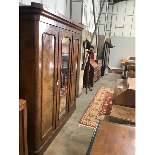 1152 - A Victorian figured walnut mirrored compactum wardrobe, width 192cm, depth 49cm, height 208cm. Condi... 