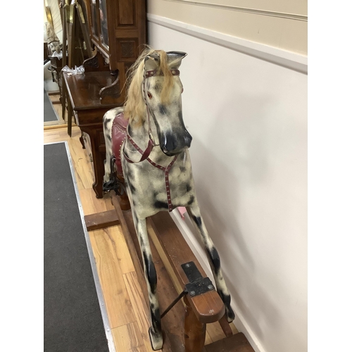 1169 - A large mid 20th century dapple grey rocking horse, on pine safety frame, length 168cm, height 135cm... 