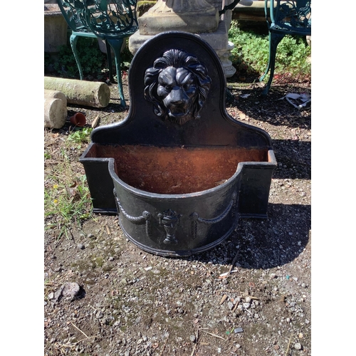 1199 - A pair of cast iron lion mask bowfront garden planters, width 69cm, height 65cm. Condition - fair... 