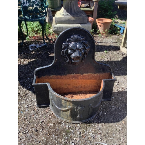 1199 - A pair of cast iron lion mask bowfront garden planters, width 69cm, height 65cm. Condition - fair... 