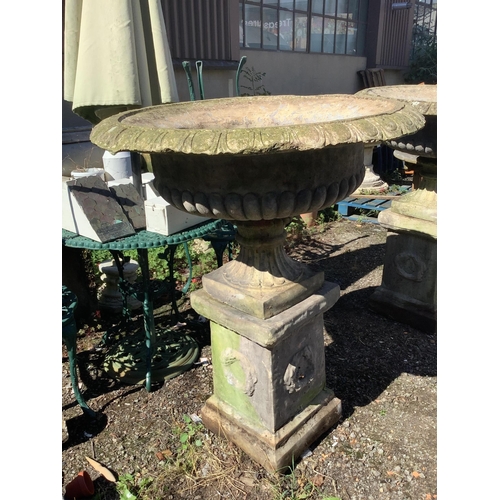 1200 - A pair of reconstituted stone campana garden urns on square pedestals, width 94cm, height 116cm. Con... 