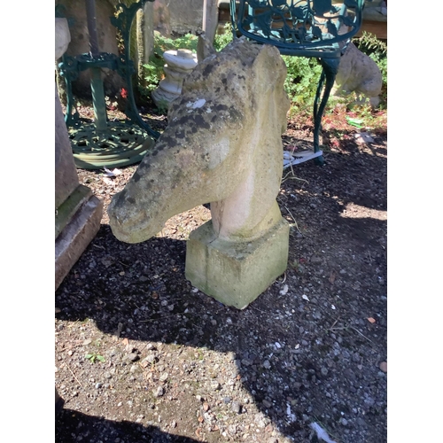 1202 - A reconstituted stone horse head garden ornament, height 60cm. Condition - fair