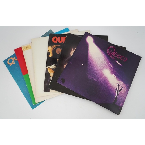 1292 - Seven Queen LP record albums and a 12 single; Queen, Queen II, Sheer Heart Attack, A Night at the O... 