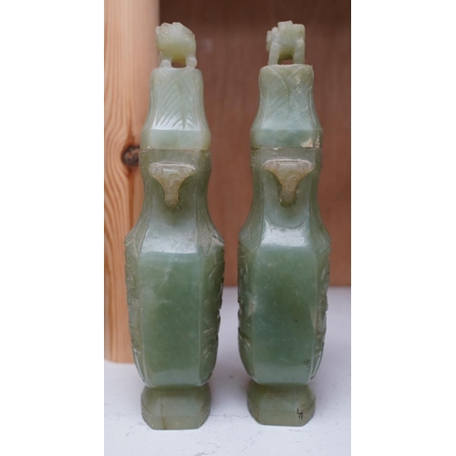 1405 - A pair of Chinese carved green quartz vases and covers, 21cm. Condition - fair, natural crack to bod... 