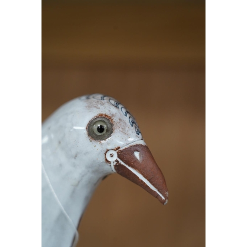 1412 - Marion Brandis (Modern British), a partially tin glazed art pottery model of a bird, 28cm tall. Cond... 