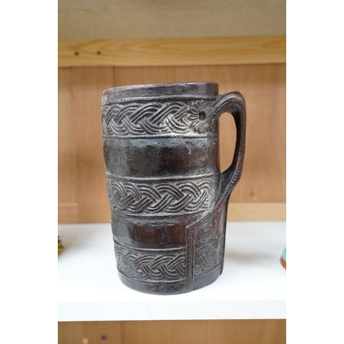 1420 - A Scandinavian carved wood tankard, lacking lid, 24cm. Condition - commensurate with age