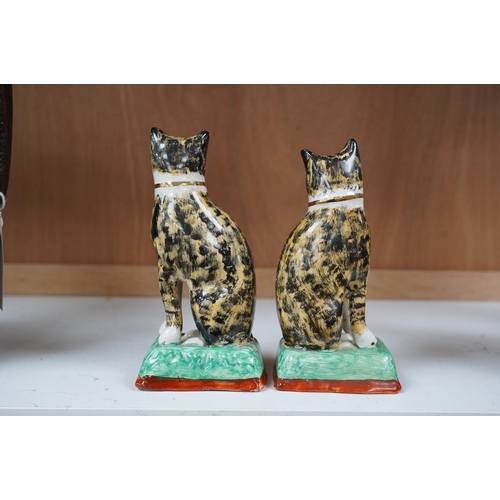 1421 - A pair of early 20th century Staffordshire cats, 17cm. Condition - good, some crazing