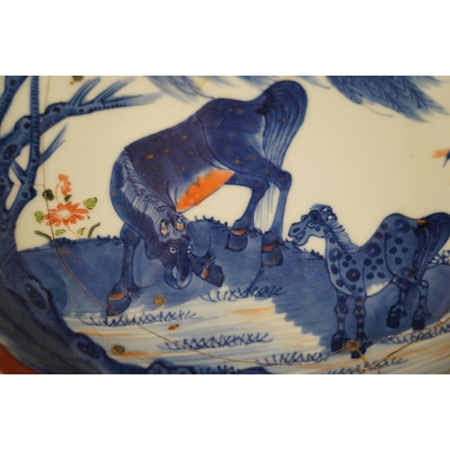 1436 - A Chinese underglaze blue and red and green enamelled 'horses' dish, Yongzheng period, 28.5cm. Condi... 