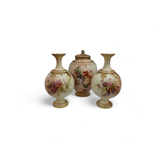 1442 - A Worcester blush ivory jar and cover, and a pair of similar vases, shape numbers 2048 and 1851, tal... 