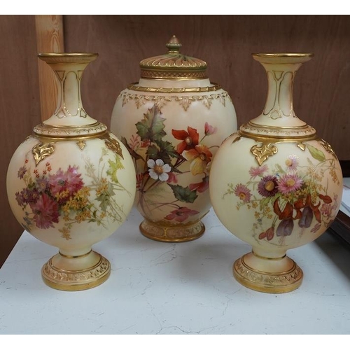 1442 - A Worcester blush ivory jar and cover, and a pair of similar vases, shape numbers 2048 and 1851, tal... 