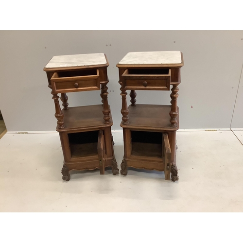 103 - A pair of late 19th / early 20th century French marble top walnut two tier bedside cabinets, width 4... 