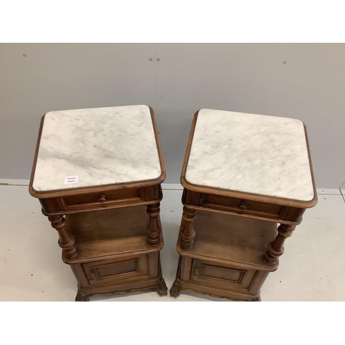 103 - A pair of late 19th / early 20th century French marble top walnut two tier bedside cabinets, width 4... 