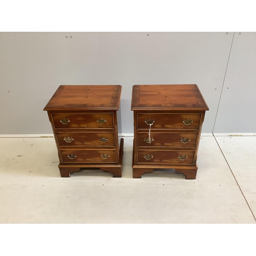 112 - A pair of reproduction yew three drawer bedside chests, width 46cm, depth 35cm, height 60cm. Conditi... 