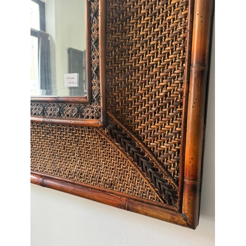 115 - A large rectangular bamboo and rattan wall mirror, width 219cm, height 126cm. Condition - good... 