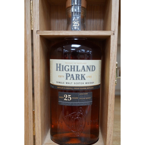 265 - A wood cased bottle of Highland Park 25 year old whisky. Condition - good