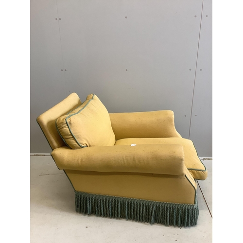 88 - A yellow upholstered Howard style club armchair, width 82cm, depth 90cm, height 70cm. Condition - po... 