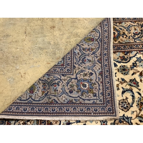 93 - A Tabriz ivory ground carpet, 294 x 198cm. Condition - fair