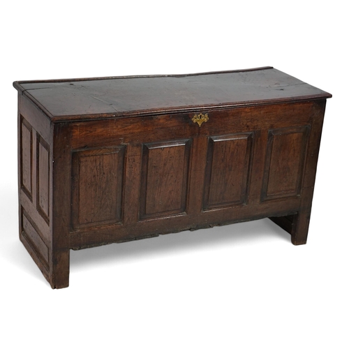 1 - A 17th century panelled oak coffer with plain single plank top and fielded panelled sides, on stile ... 