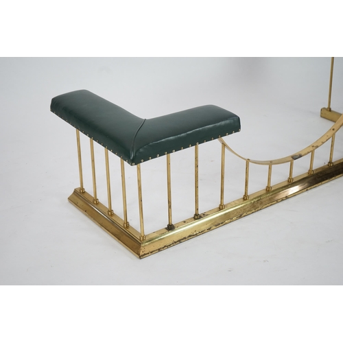 11 - A brass club fender with green leather upholstered padded tops, 175cm wide, 64cm deep, 51cm high... 