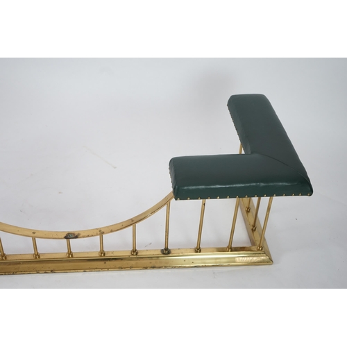 11 - A brass club fender with green leather upholstered padded tops, 175cm wide, 64cm deep, 51cm high... 