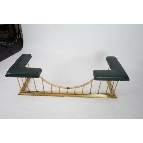 11 - A brass club fender with green leather upholstered padded tops, 175cm wide, 64cm deep, 51cm high... 