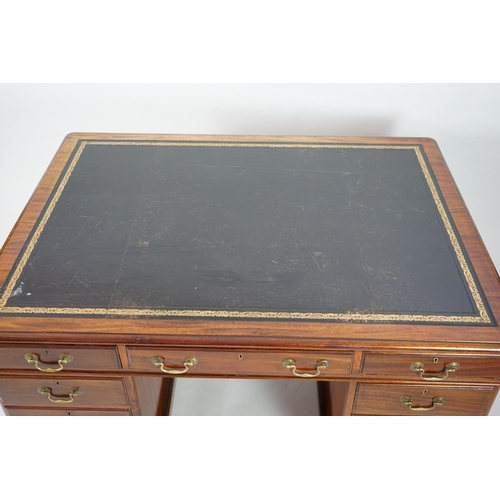 12 - A Victorian mahogany partner's desk with green leather skiver, fitted nine drawers opposing three dr... 