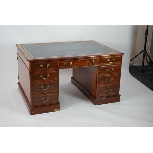 12 - A Victorian mahogany partner's desk with green leather skiver, fitted nine drawers opposing three dr... 