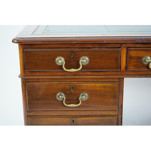 12 - A Victorian mahogany partner's desk with green leather skiver, fitted nine drawers opposing three dr... 