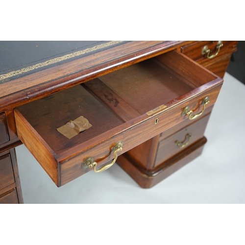 12 - A Victorian mahogany partner's desk with green leather skiver, fitted nine drawers opposing three dr... 