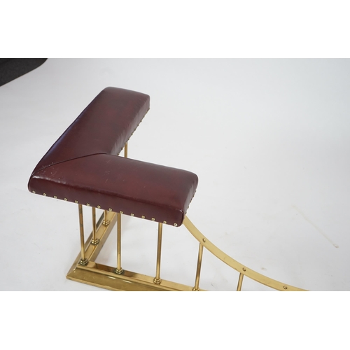 13 - A brass club fender with burgundy leather upholstered padded tops, 169cm wide, 61cm deep, 50cm high... 