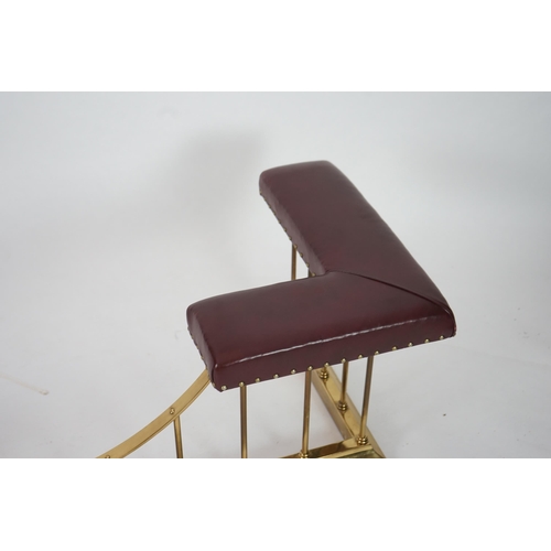 13 - A brass club fender with burgundy leather upholstered padded tops, 169cm wide, 61cm deep, 50cm high... 