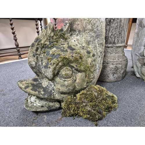 18 - A reconstituted stone bird bath with central bowl and dolphin brackets, on a circular plinth, 136cm ... 