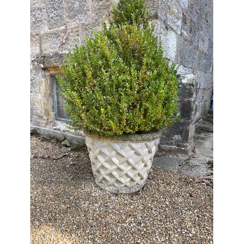 19 - A set of four reconstituted stone garden vases with lattice work decoration, 60cm diameter, 45cm hig... 