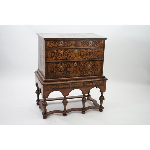 2 - A William and Mary walnut and marquetry chest on stand with floral marquetry panels to the top, fron... 