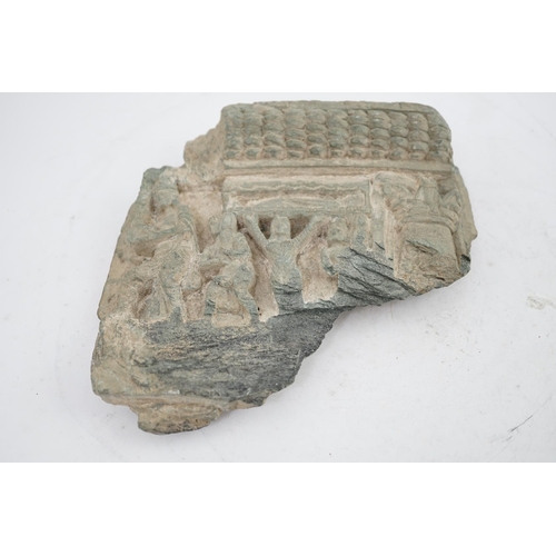 24 - A Gandharan green schist relief fragment, probably 2nd/3rd century AD, 21cm wide, 20cm high