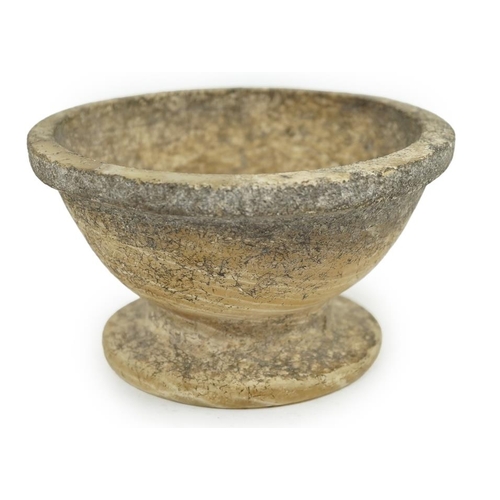 25 - An archaic alabaster footed bowl, possibly Egyptian, mineral encrustation, 15.25cm diameter, 8.5cm h... 