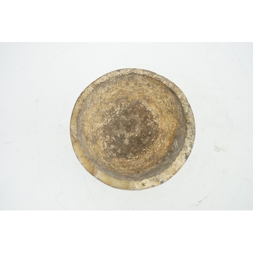 25 - An archaic alabaster footed bowl, possibly Egyptian, mineral encrustation, 15.25cm diameter, 8.5cm h... 