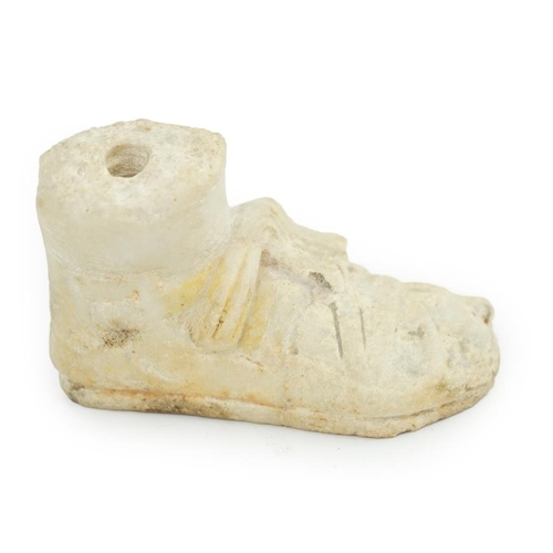 27 - A Roman carved marble model of a sandalled foot, 10cm long, 5.75cm high