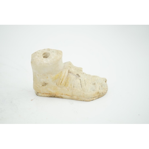 27 - A Roman carved marble model of a sandalled foot, 10cm long, 5.75cm high