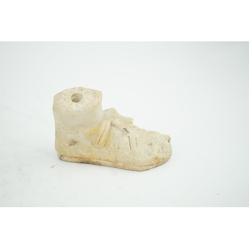 27 - A Roman carved marble model of a sandalled foot, 10cm long, 5.75cm high