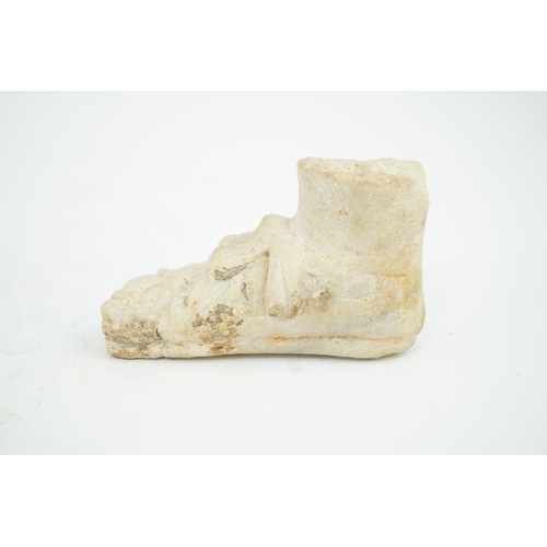 27 - A Roman carved marble model of a sandalled foot, 10cm long, 5.75cm high