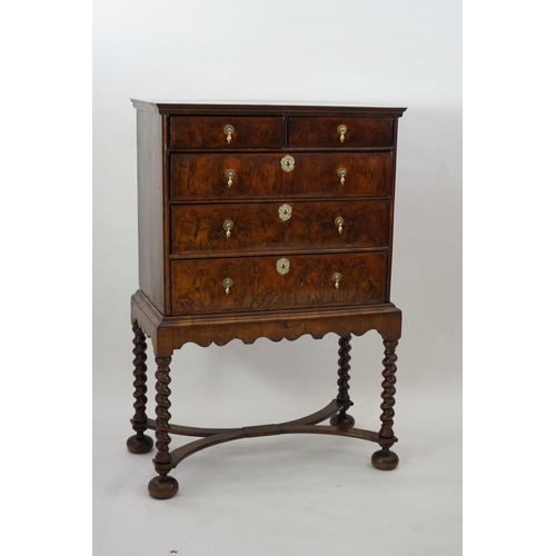 3 - An early 18th century and later crossbanded walnut chest on stand with moulded cornice, two short an... 