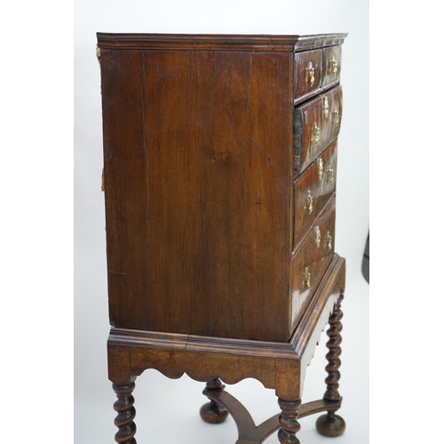 3 - An early 18th century and later crossbanded walnut chest on stand with moulded cornice, two short an... 