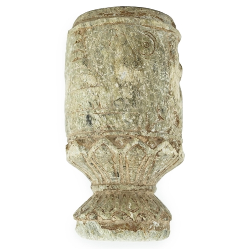 30 - A Gandharan Buddhist carved schist stem cup, carved in relief with figures and a stupa, 6.5cm diamet... 