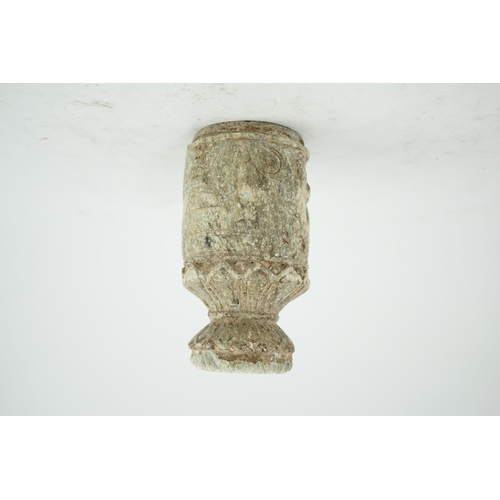 30 - A Gandharan Buddhist carved schist stem cup, carved in relief with figures and a stupa, 6.5cm diamet... 