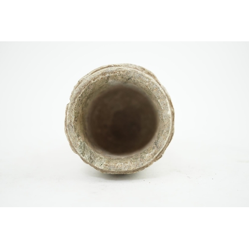 30 - A Gandharan Buddhist carved schist stem cup, carved in relief with figures and a stupa, 6.5cm diamet... 