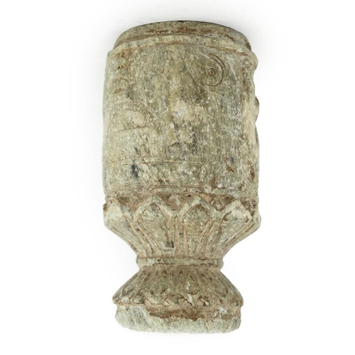 30 - A Gandharan Buddhist carved schist stem cup, carved in relief with figures and a stupa, 6.5cm diamet... 